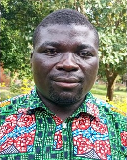 A teacher interacting with children in a classroom